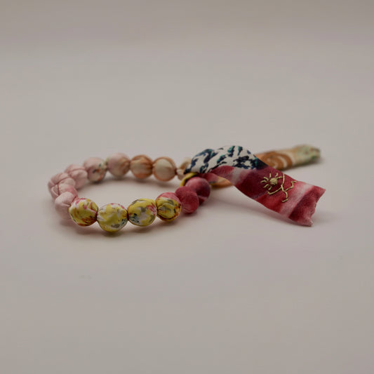Bracelet perles de soie jaune et rose pale