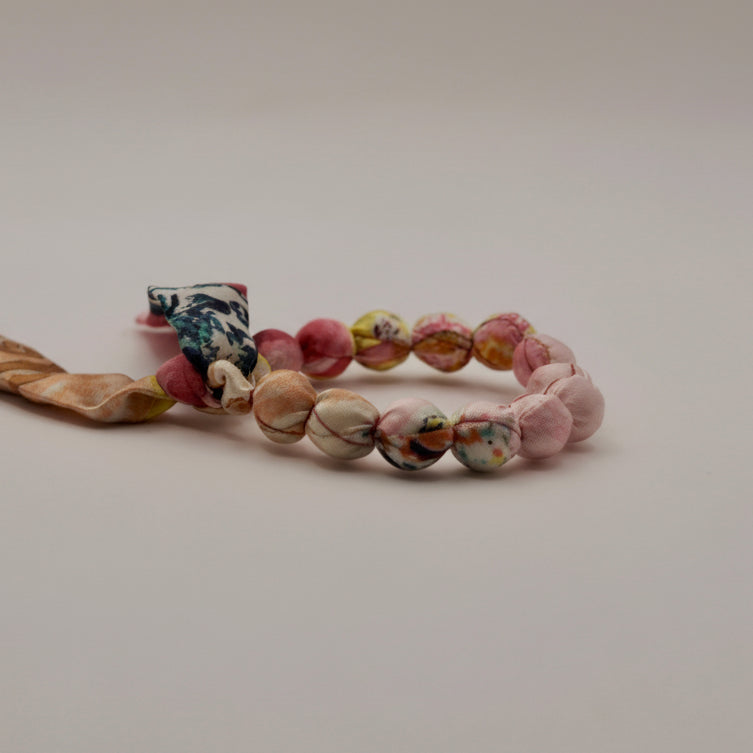 Bracelet perles de soie jaune et rose pale