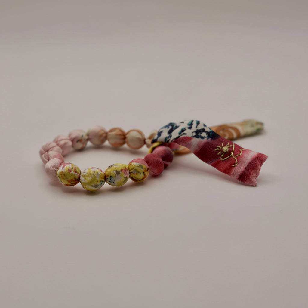 Bracelet perles de soie jaune et rose pale