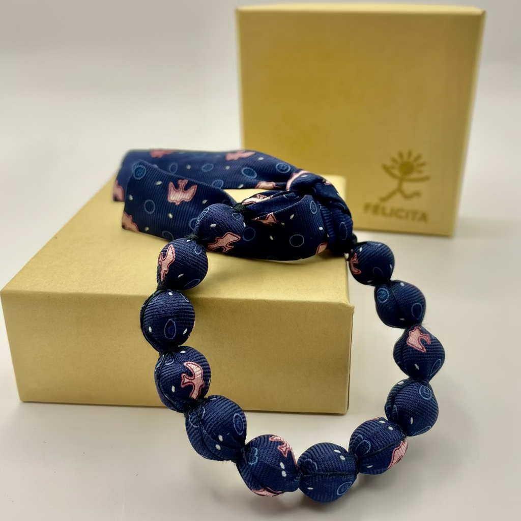 Bracelet perles de soie bleu marine et rose motif hirondelles